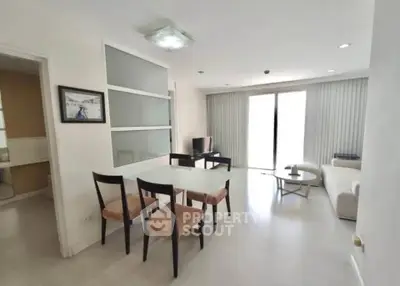 Modern living room with dining area and natural light in stylish apartment