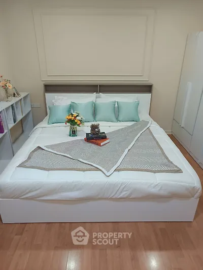 Cozy bedroom with elegant decor and stylish bedding, perfect for relaxation and comfort.