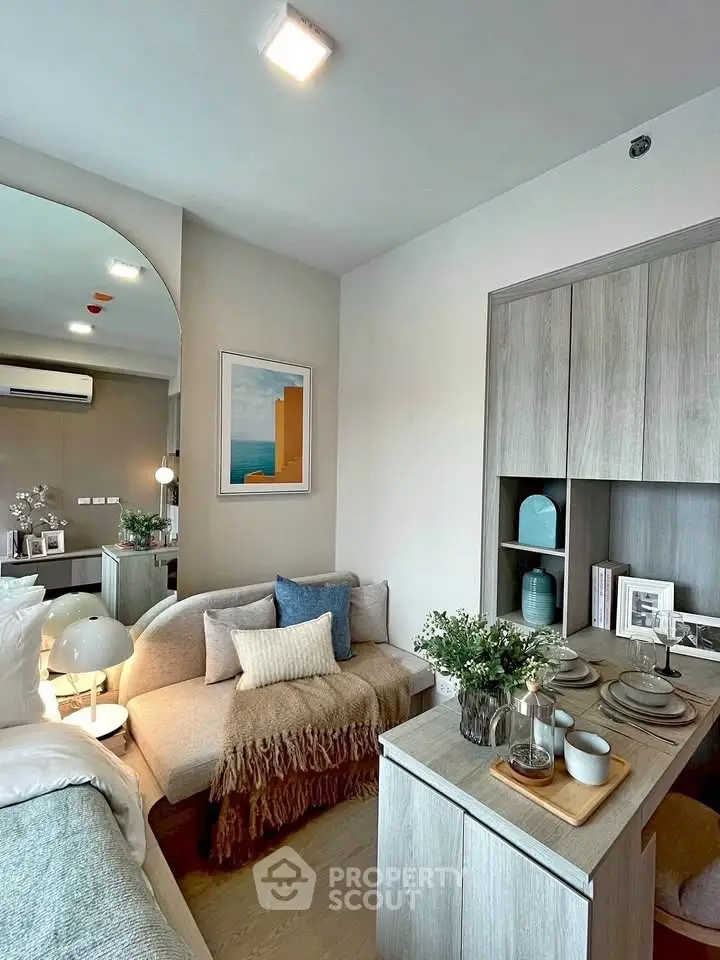 Stylish modern living room with cozy sofa and elegant decor in a contemporary apartment.