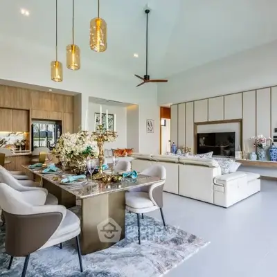 Luxurious open-plan living room with elegant dining area and modern decor