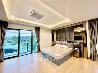Luxurious bedroom with modern design and large windows offering a stunning view, perfect for relaxation.