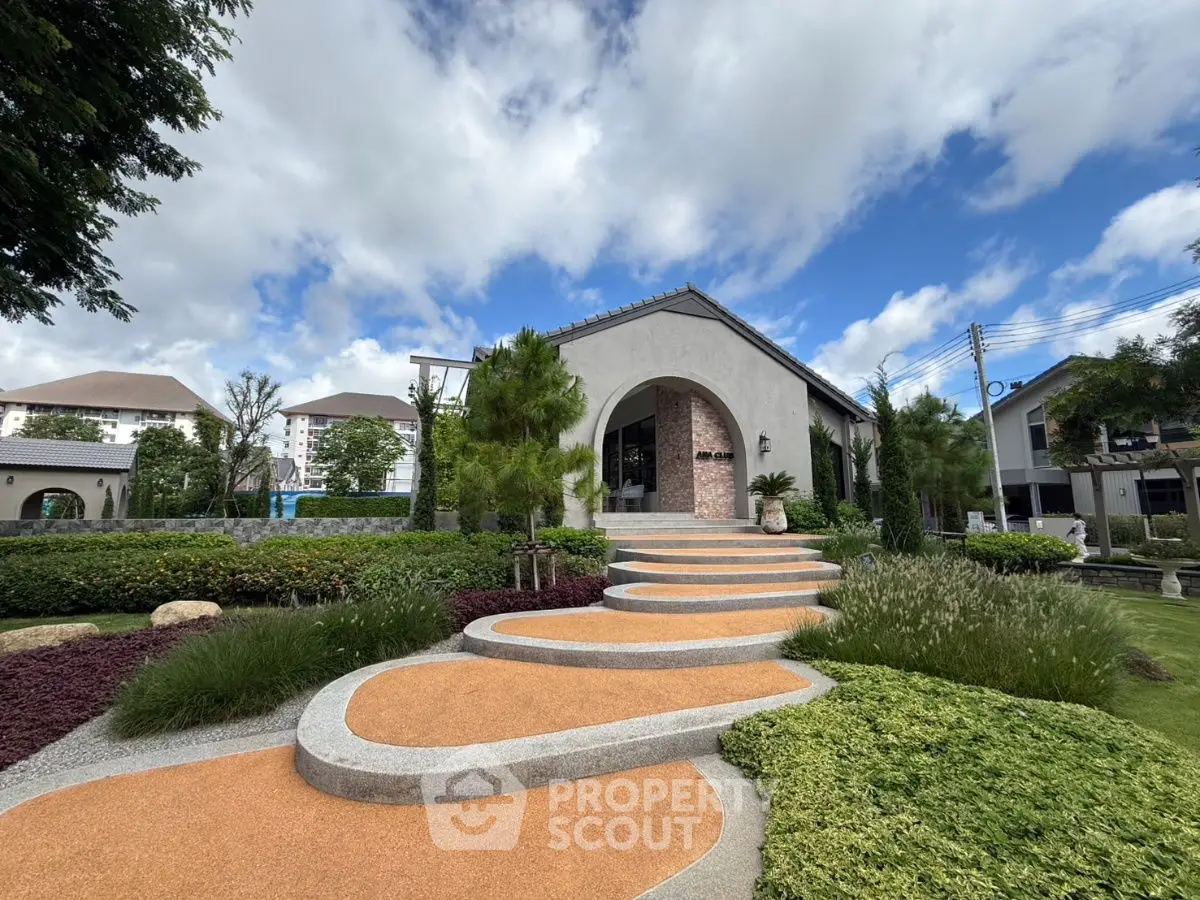 Charming modern house with landscaped garden and unique curved pathway
