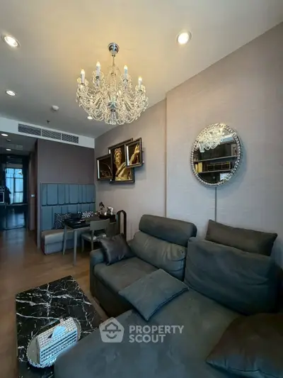 Luxurious living room with elegant chandelier and modern decor