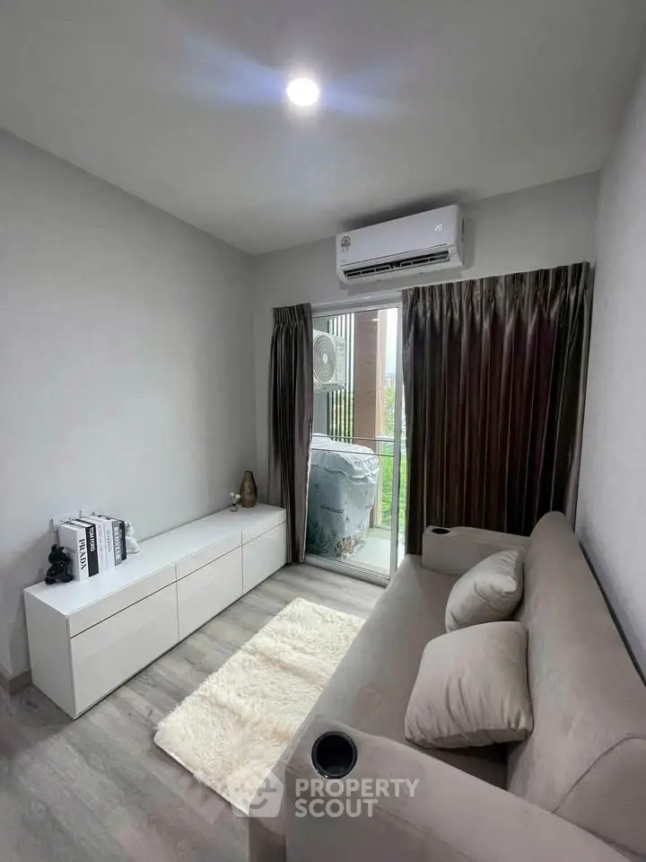 Cozy living room with modern sofa and balcony view