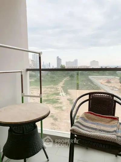 Charming balcony with city view, perfect for relaxation and enjoying the skyline.
