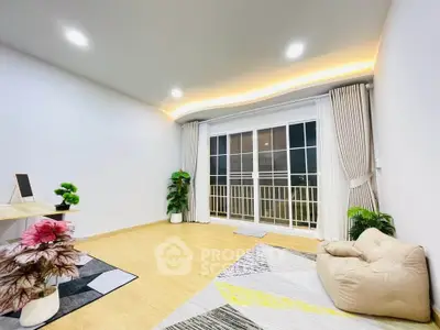 Spacious modern living room with large windows and stylish decor