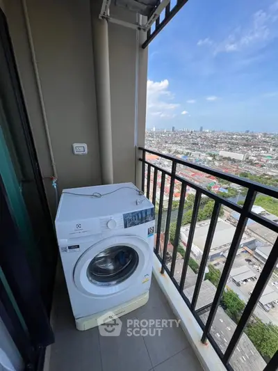 High-rise balcony with washing machine and panoramic city view