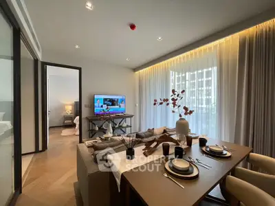 Modern living room with dining area, stylish decor, and natural light from large windows.