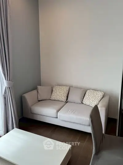 Cozy living room with modern sofa and elegant curtains