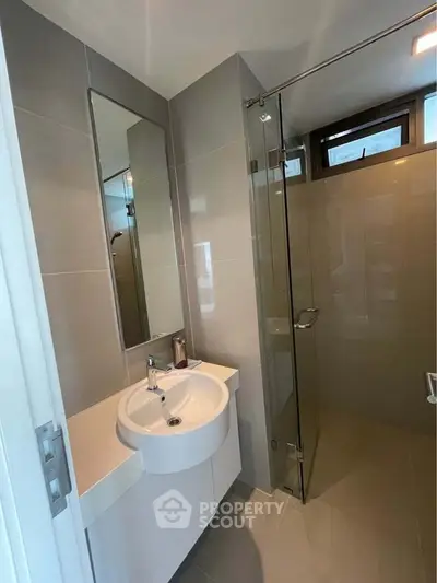 Modern bathroom with sleek design and glass shower enclosure