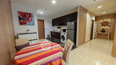 Modern open-layout kitchen and dining area with stylish decor and appliances.
