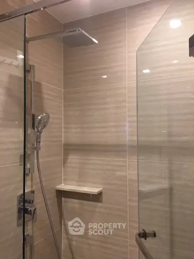 Modern bathroom with sleek glass shower and elegant tile design