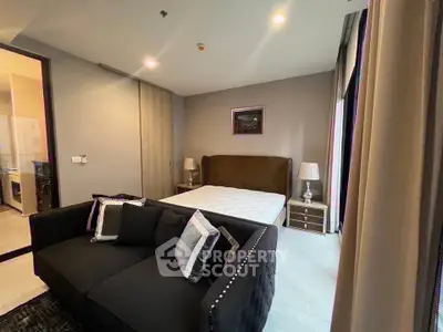 Modern bedroom with stylish decor and cozy seating area