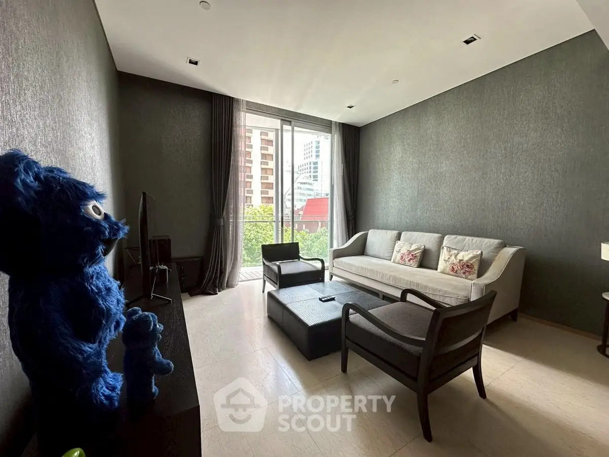 Modern living room with stylish furniture and large window view