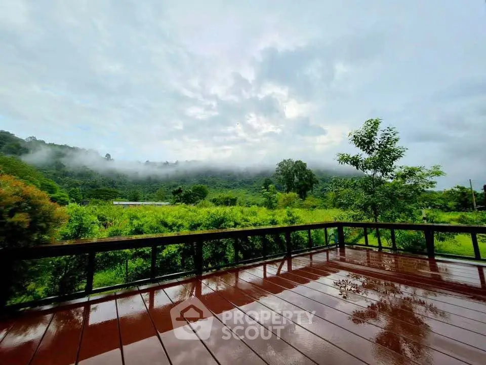 Stunning wooden deck with breathtaking mountain and forest views, perfect for nature lovers.