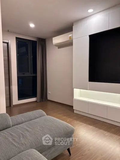 Modern living room with sleek design and cozy ambiance