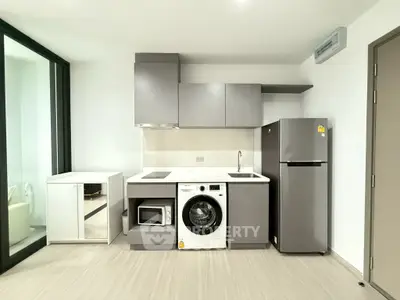 Modern kitchen with sleek appliances and minimalist design