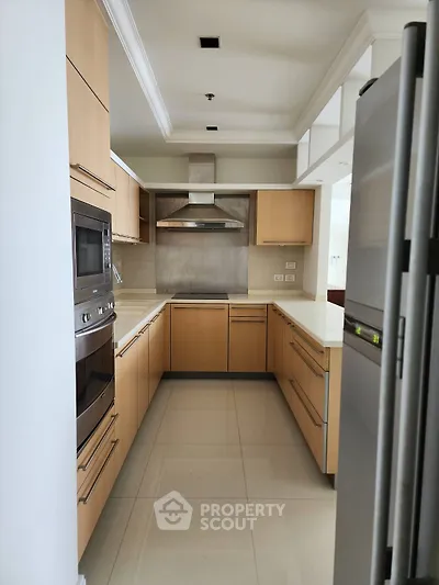 Modern kitchen with sleek cabinetry and stainless steel appliances