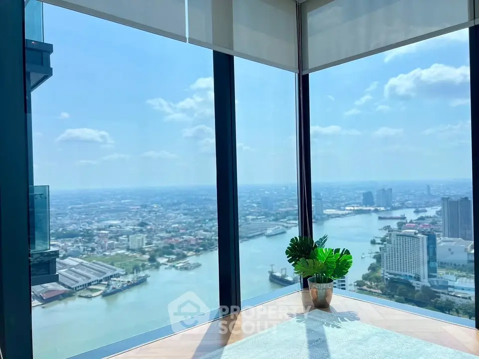 Stunning corner unit with panoramic river view and floor-to-ceiling windows.