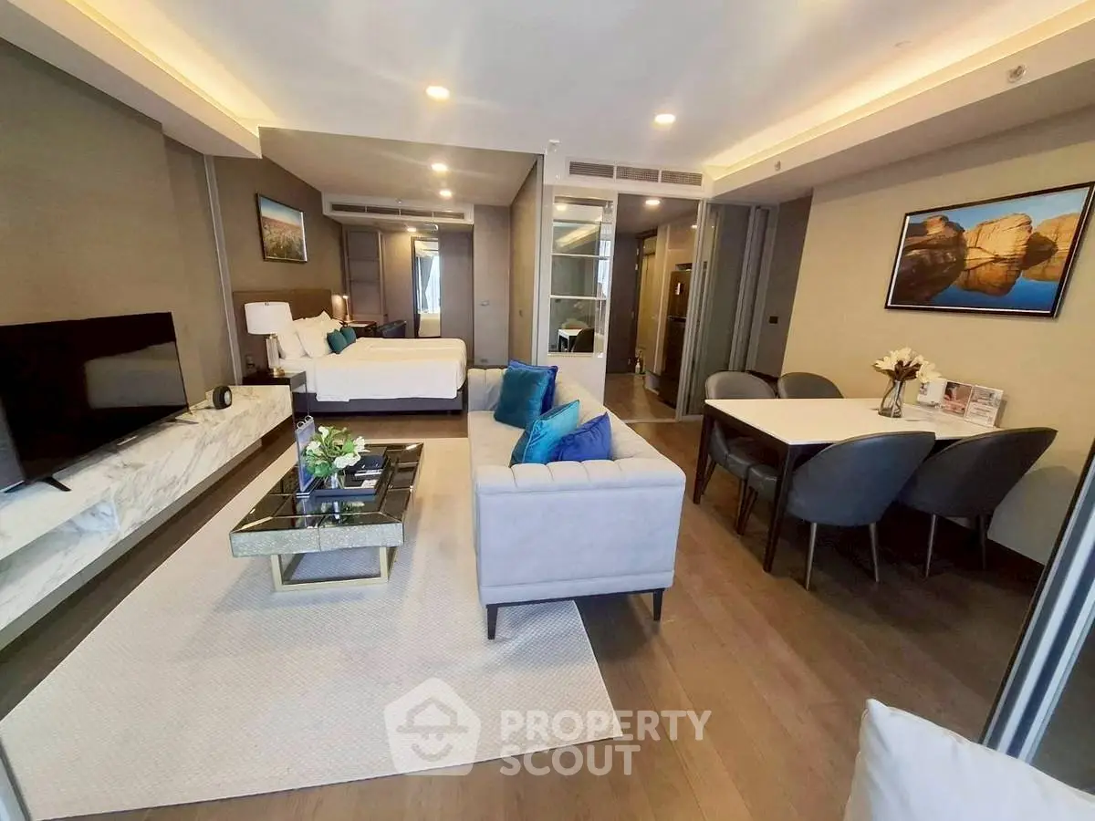 Luxurious open-plan living room with modern decor and elegant dining area