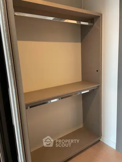 Spacious walk-in closet with modern shelving in a luxury apartment