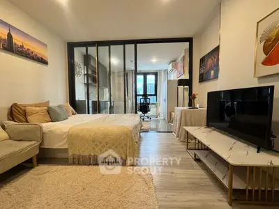 Modern studio apartment with cozy living area and stylish decor