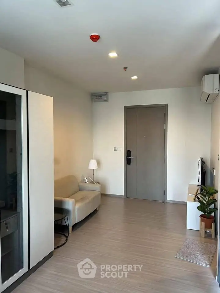 Modern living room with minimalist decor and sleek flooring