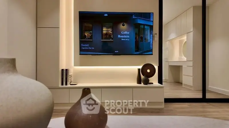 Modern living room with stylish decor and wall-mounted TV