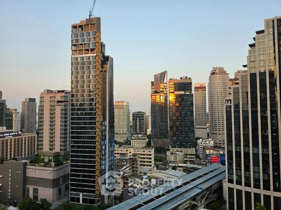Stunning cityscape view of modern high-rise buildings at sunset, showcasing urban living and architectural elegance.