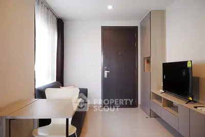 Modern living room with sleek furniture and natural light, perfect for urban living.