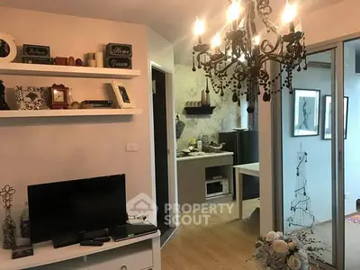 Charming living room with elegant chandelier and cozy decor