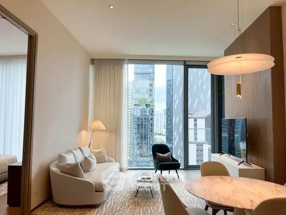 Modern living room with city view, elegant furniture, and stylish lighting.