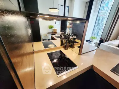 Modern kitchen with sleek induction cooktop and stylish dining area