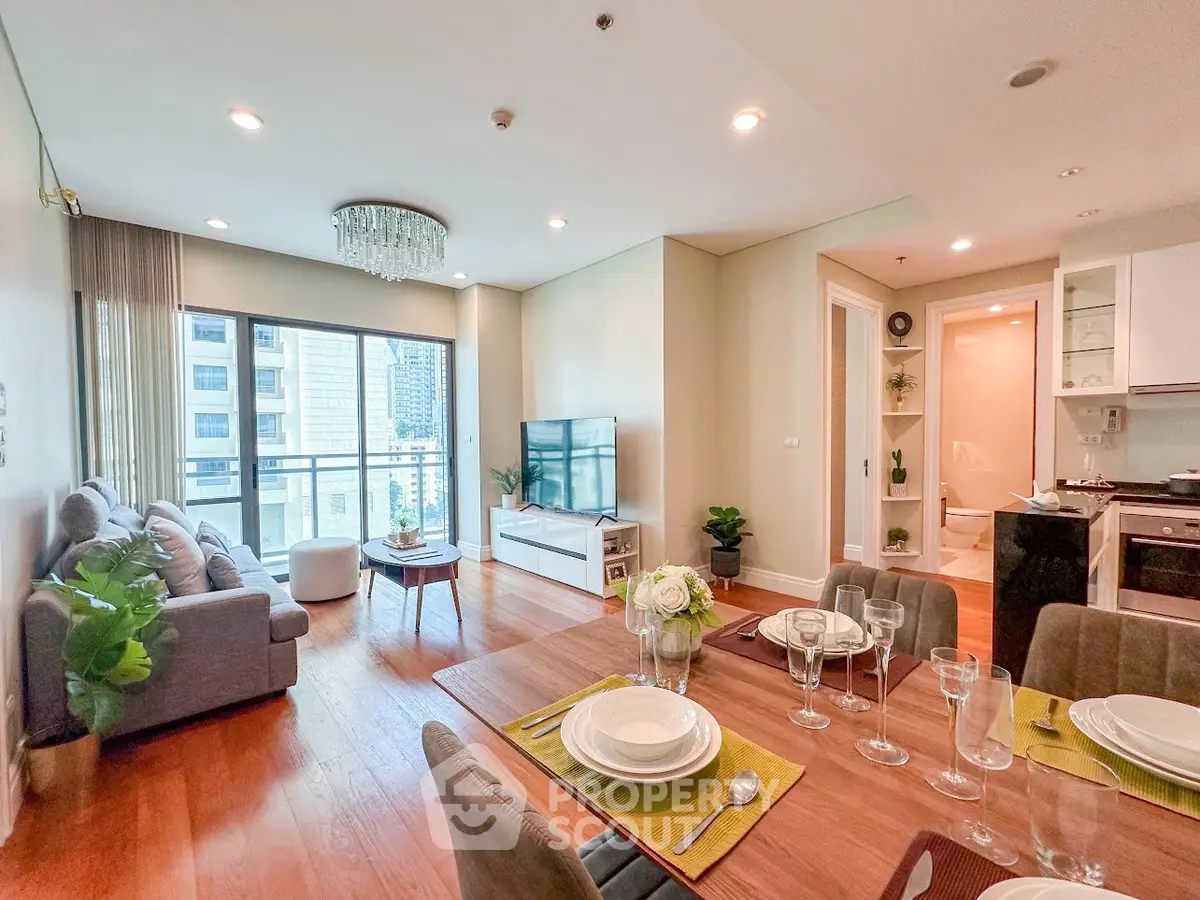 Spacious modern living room with dining area and balcony view in luxury apartment