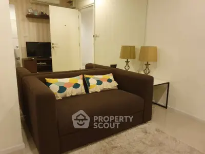Cozy living room with brown sofa and stylish decor in modern apartment.