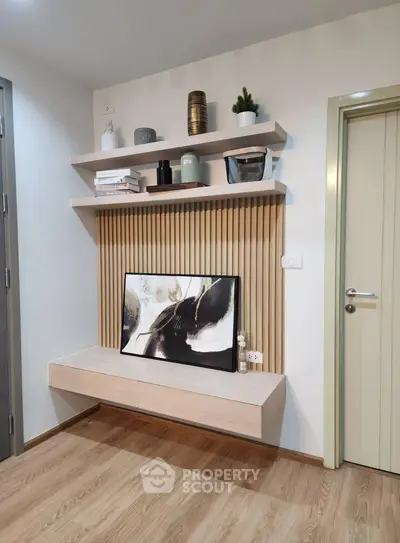 Modern living room with stylish wall shelves and decorative elements
