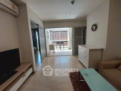 Spacious living room with modern decor and natural light