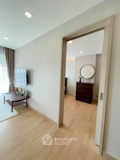 Modern living room with wooden flooring and stylish decor