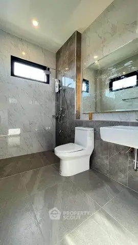 Modern bathroom with sleek design and large mirror