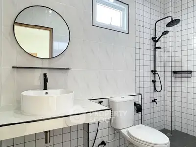 Modern bathroom with sleek fixtures and stylish tile design