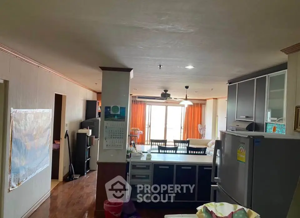 Spacious open-layout kitchen and dining area with modern appliances and ample natural light.
