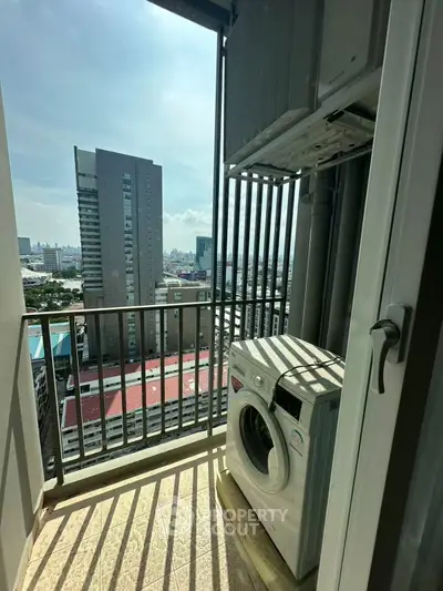 High-rise apartment balcony with washing machine and city view