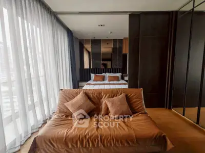 Luxurious modern bedroom with floor-to-ceiling windows and elegant furnishings