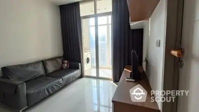 Modern living room with balcony and washing machine, featuring sleek furniture and natural light.