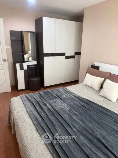Cozy bedroom with modern furniture and stylish decor, perfect for relaxation and comfort.