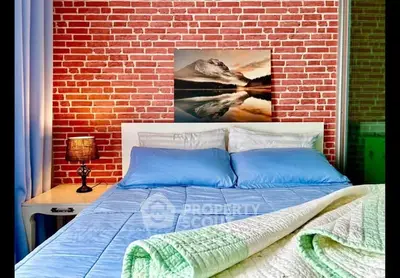 Cozy bedroom with brick accent wall and modern decor