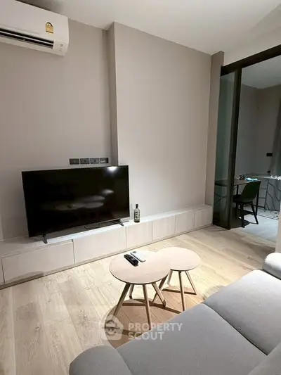 Modern living room with sleek TV setup and stylish furniture