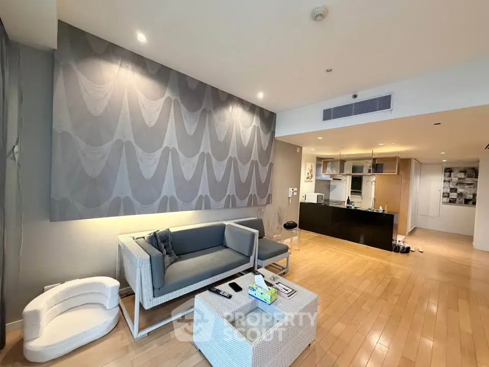 Spacious modern living room with open kitchen and stylish decor