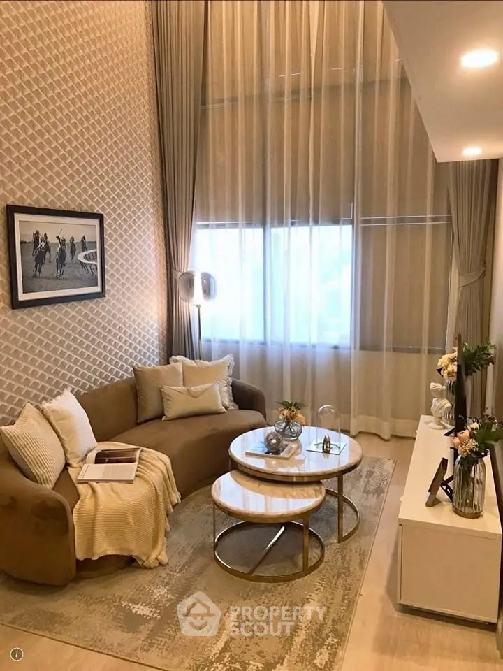 Elegant living room with high ceilings, cozy sofa, and stylish decor