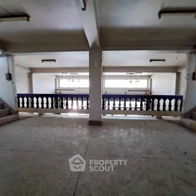 Spacious interior with open layout and natural light, ideal for versatile use.